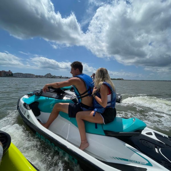 a group of people on a boat in the water