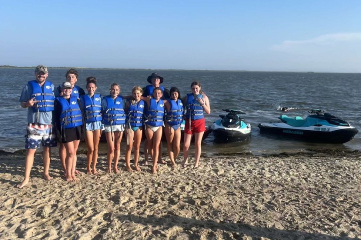 a group of people on a beach