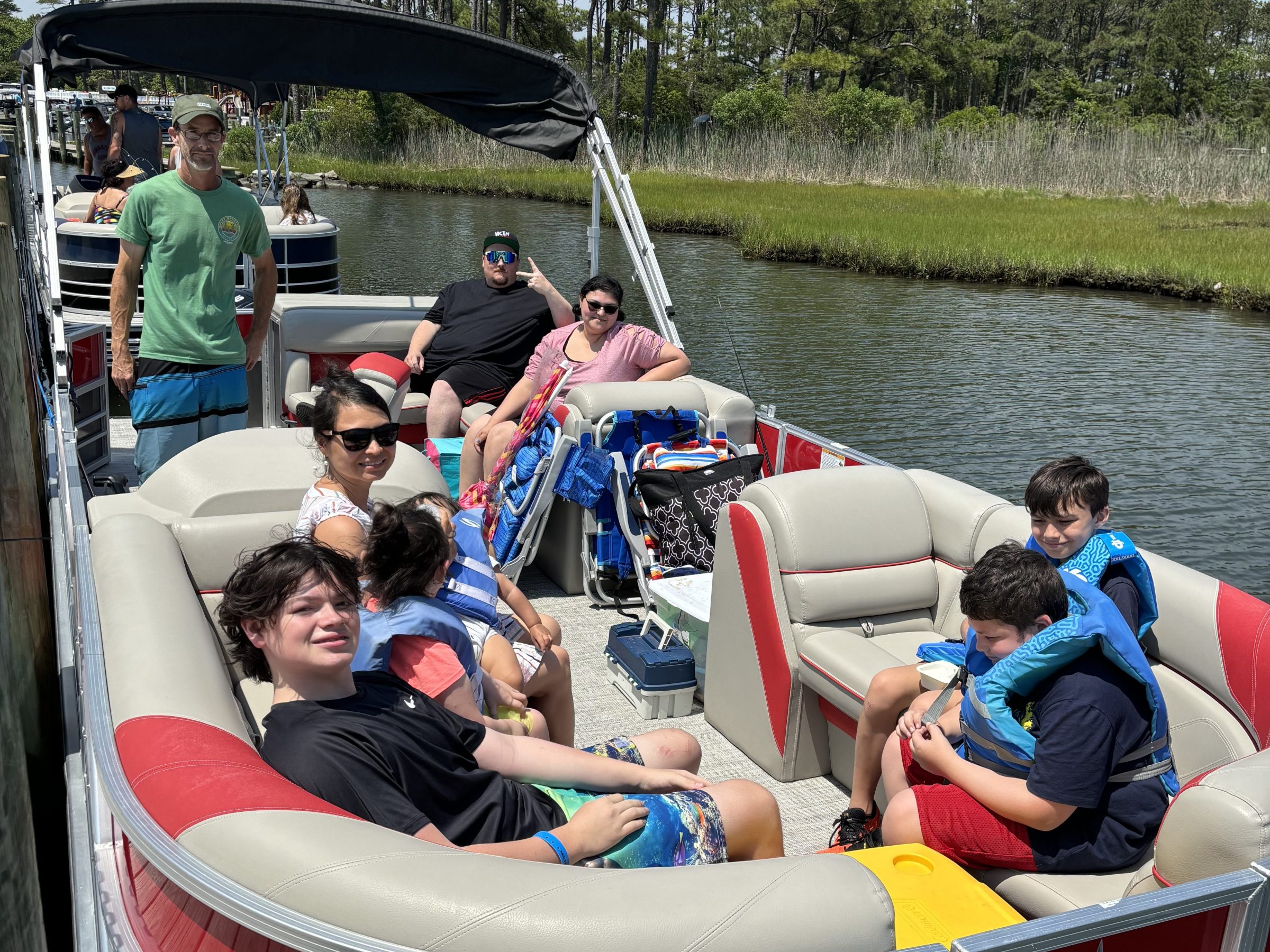 a group of people riding on the back of a boat